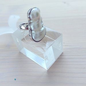 Large River pearl encased in .95 silver ring. Made in Peru. Unique piece